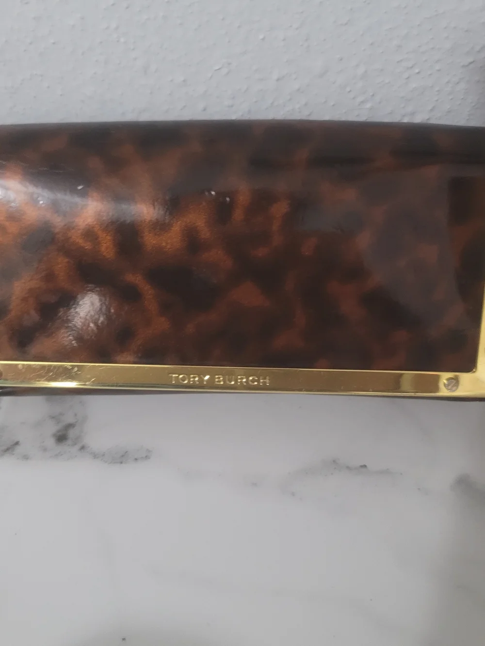 Tory Burch Black Frame Sunglasses with Blue Mirrored Lenses
